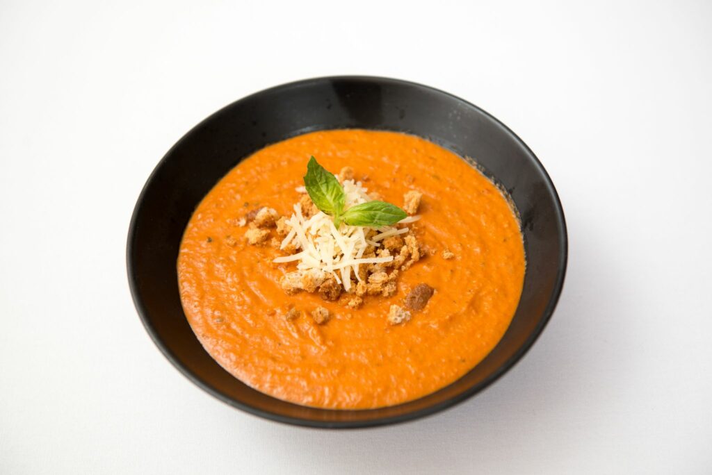 Tomato soup home made in black bowl