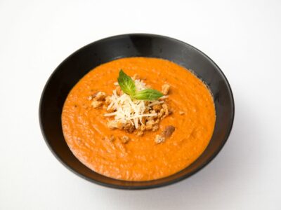 Tomato soup home made in black bowl