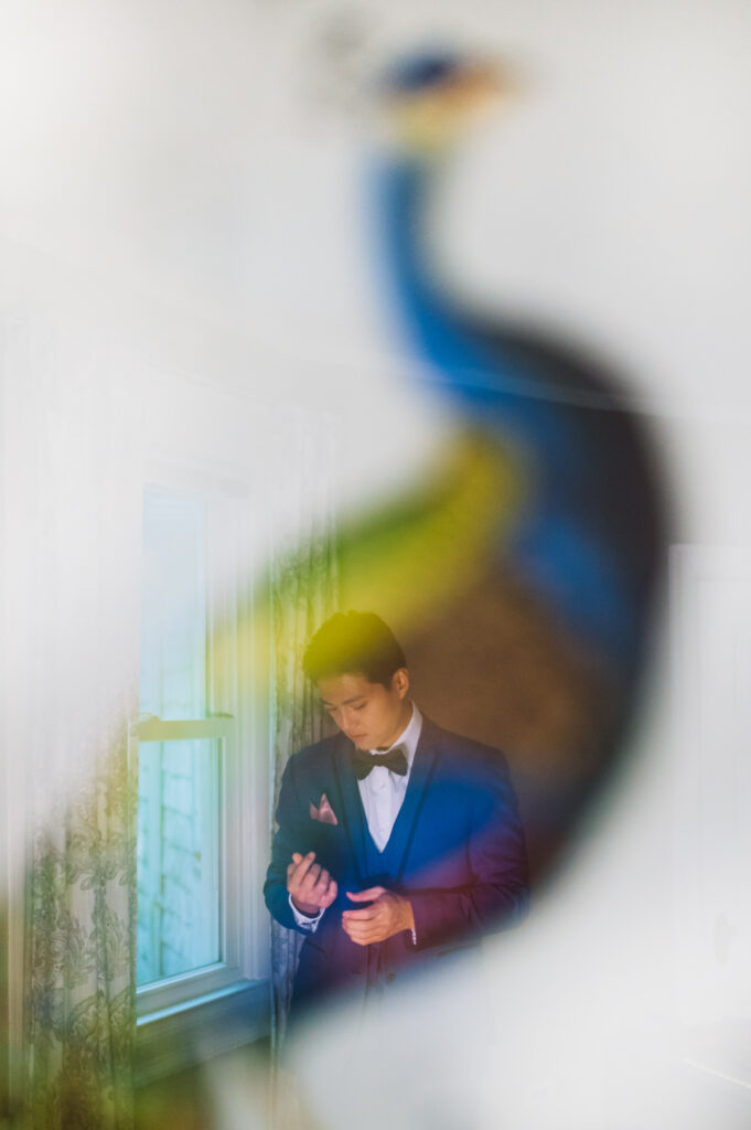 artsy keyhole photograph of groom