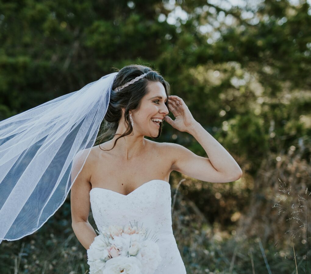 happy bride outside with nature behind