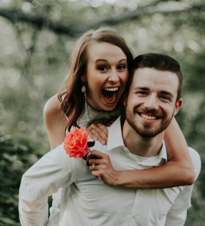 bride and groom happy smiles with green natural background