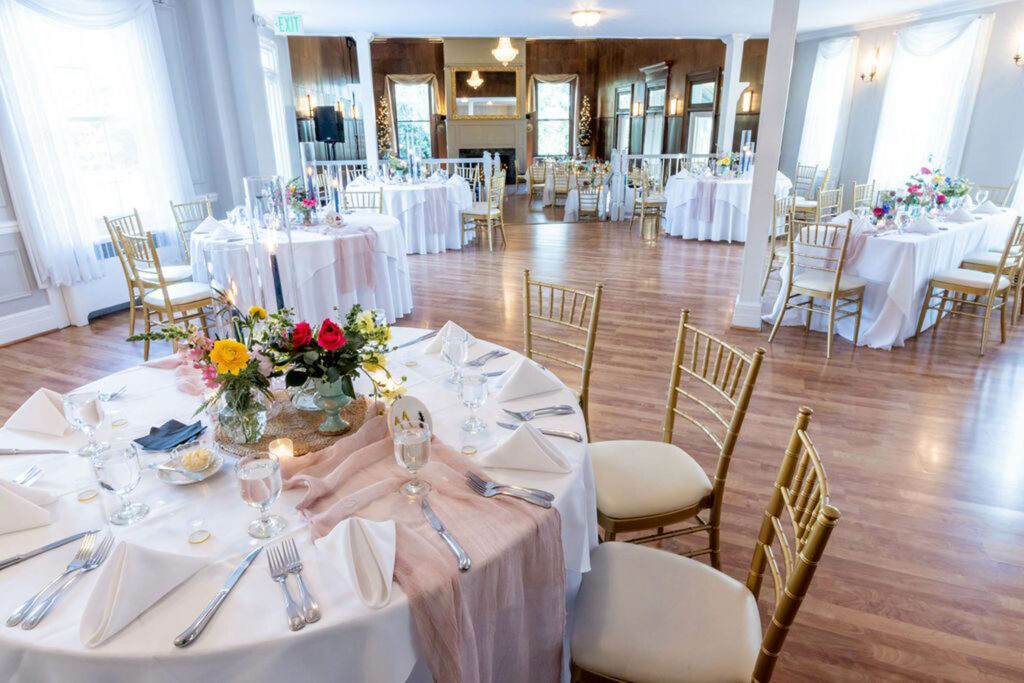 wedding reception venue setup, white with gold chairs