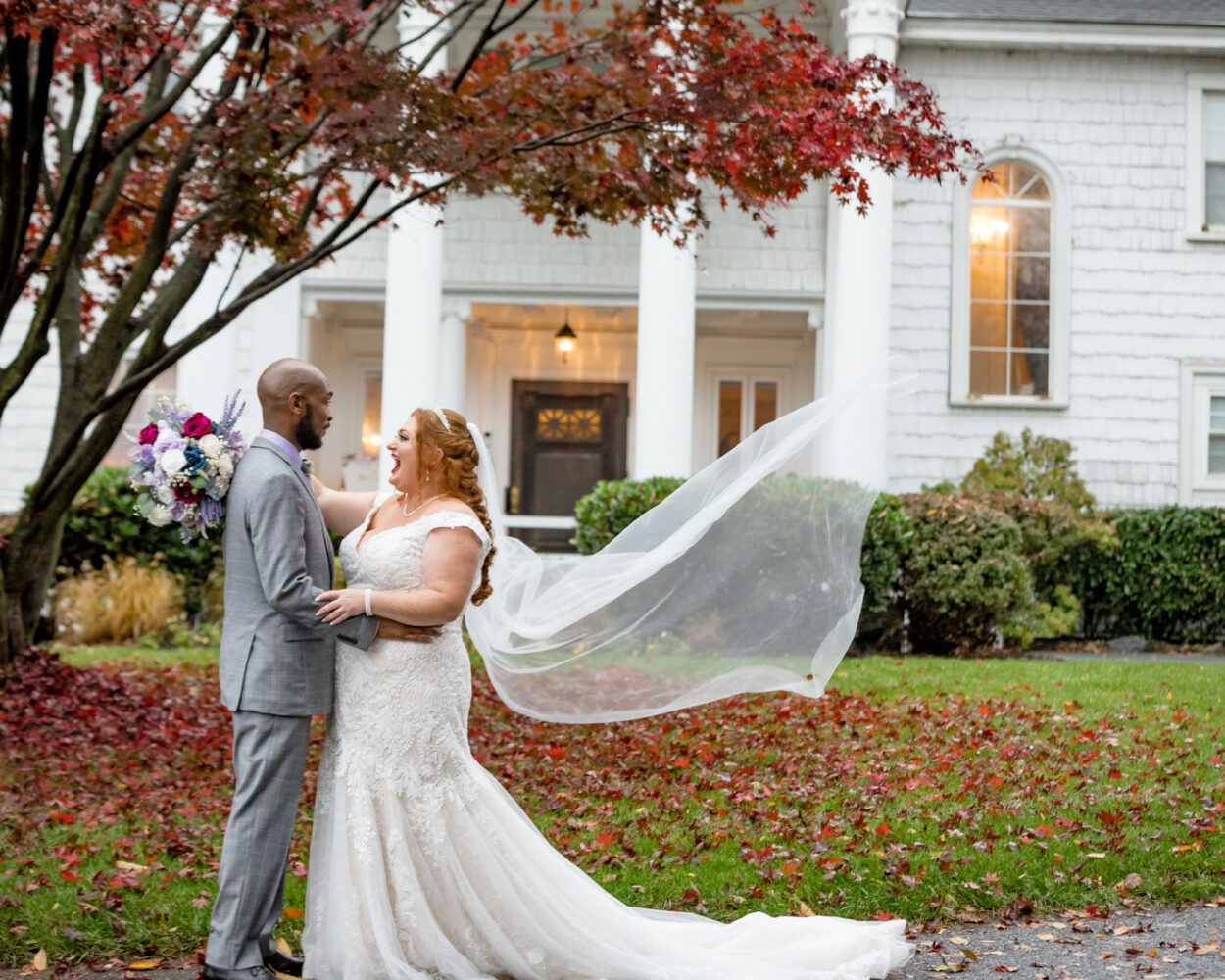 bride and groom outside historic mansion wedding venue