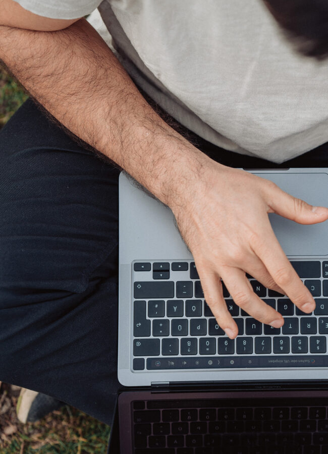 Man typing on laptop