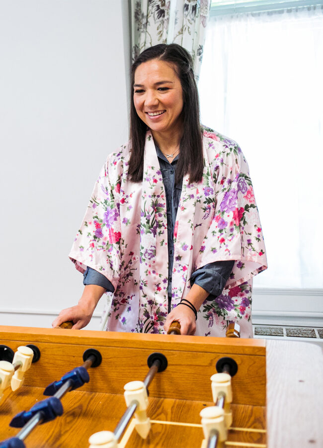 Woman playing foosball