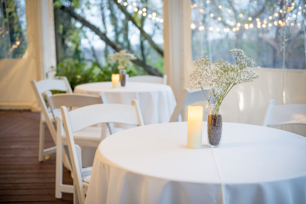 white tables set for elegant wedding