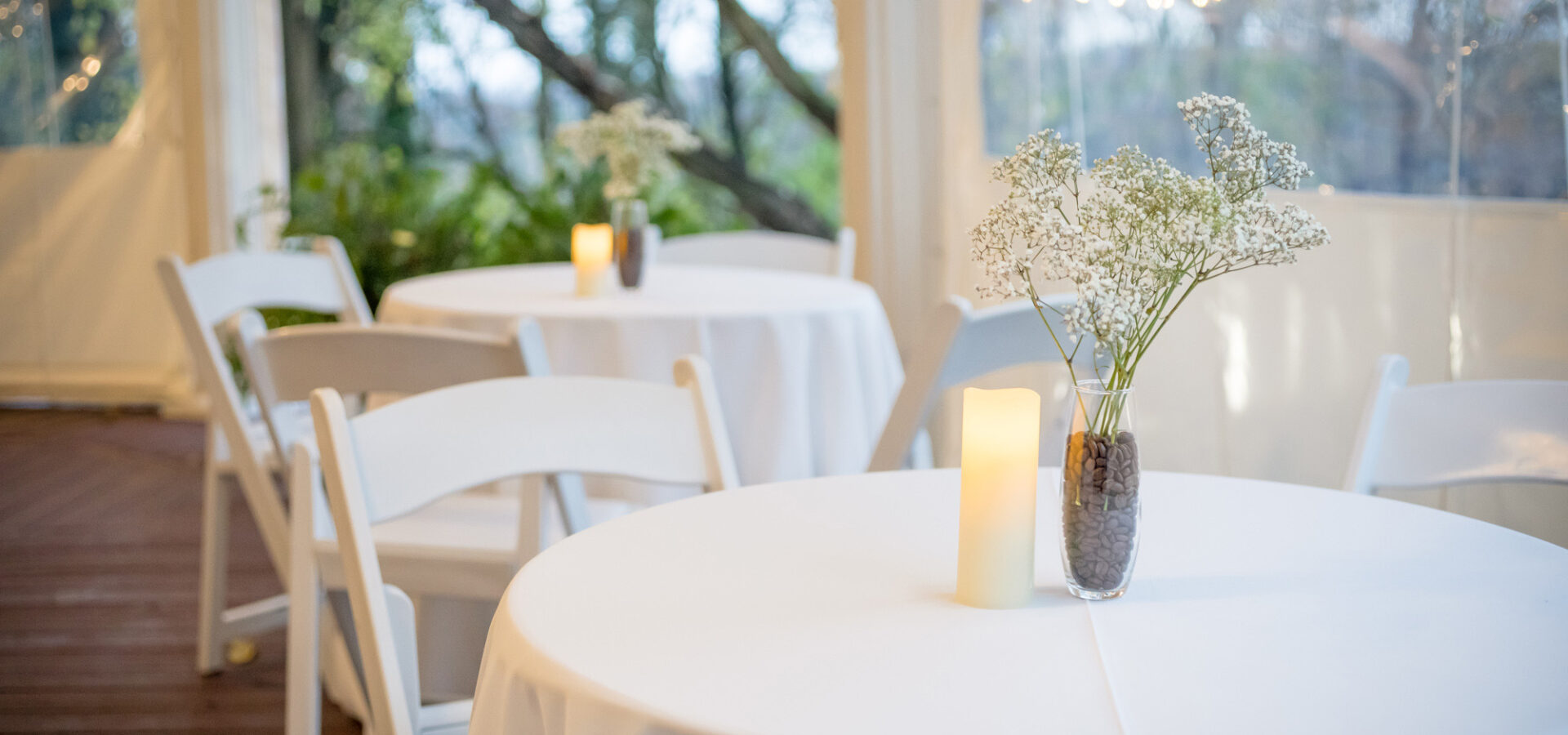 white tables set for elegant wedding